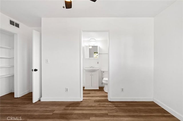 5690 Paradise Ave, Paradise, CA 95969 - unfurnished bedroom with wood finished floors, ensuite bathroom, and ceiling fan