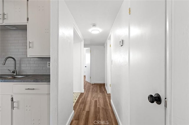 5690 Paradise Ave, Paradise, CA 95969 - hall with a sink, wood finished floors, and baseboards