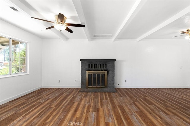 5690 Paradise Ave, Paradise, CA 95969 - unfurnished living room featuring ceiling fan, beamed ceiling, a brick fireplace, wood finished floors, and baseboards