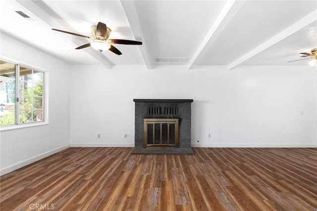5690 Paradise Ave, Paradise, CA 95969 - unfurnished living room with a ceiling fan, beam ceiling, a brick fireplace, and wood finished floors