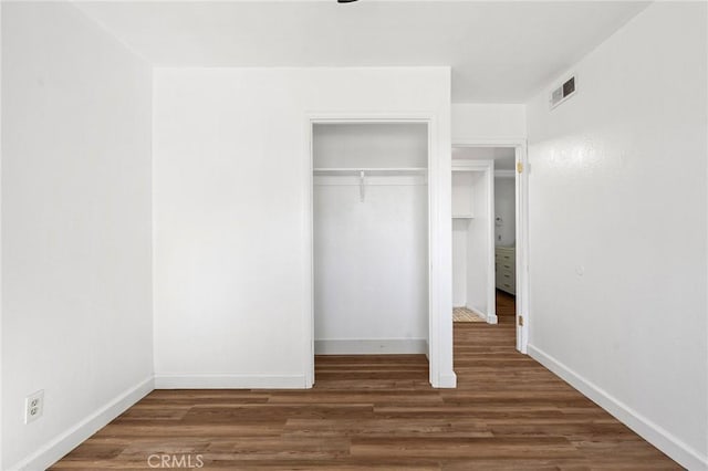 5690 Paradise Ave, Paradise, CA 95969 - unfurnished bedroom featuring wood finished floors, a closet, and baseboards