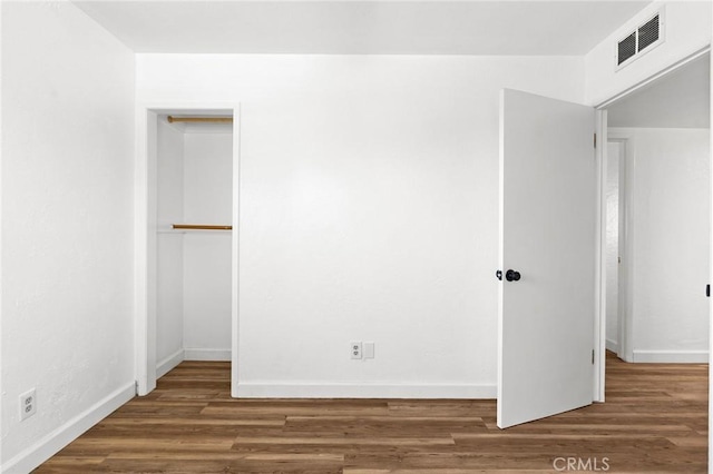 5690 Paradise Ave, Paradise, CA 95969 - unfurnished bedroom featuring wood finished floors and a closet
