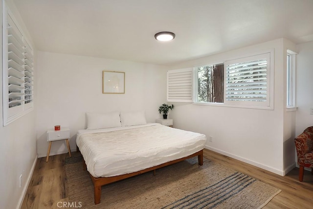 bedroom featuring wood-type flooring