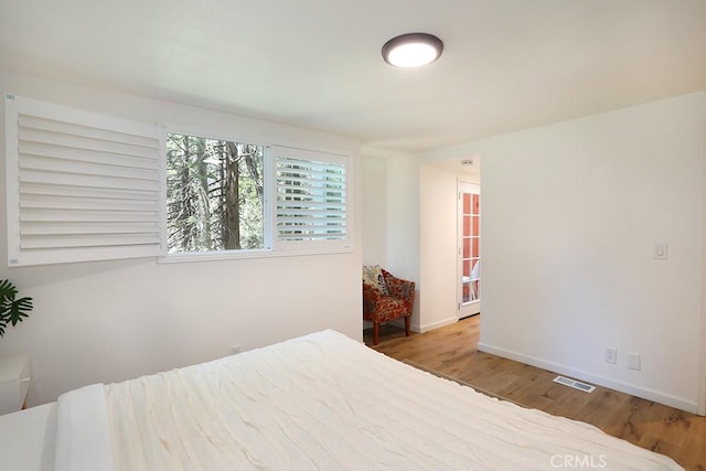 bedroom with light hardwood / wood-style flooring