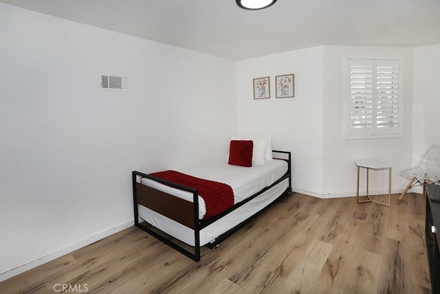 bedroom with light hardwood / wood-style flooring