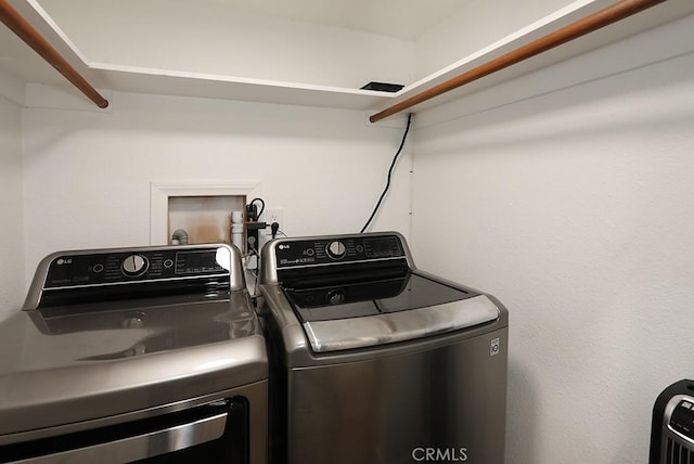 laundry area with washer and dryer