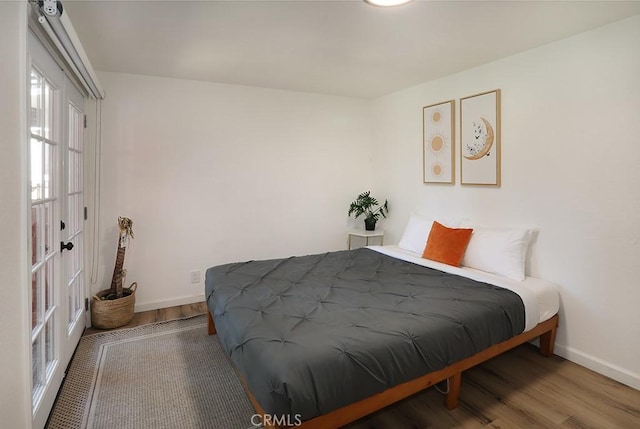 bedroom featuring hardwood / wood-style flooring