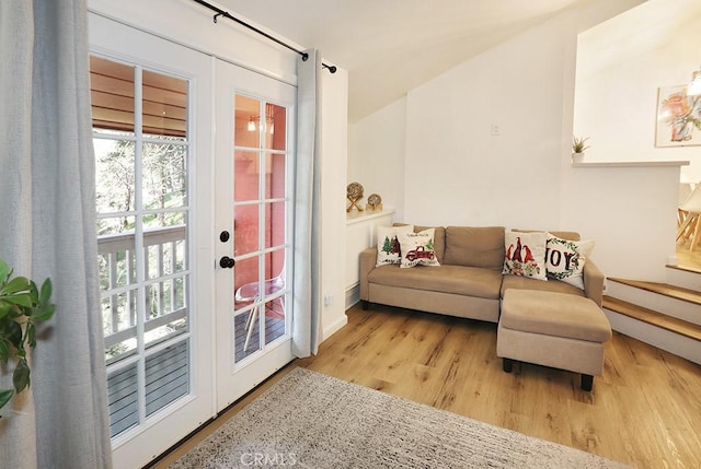 sitting room featuring light hardwood / wood-style floors and french doors