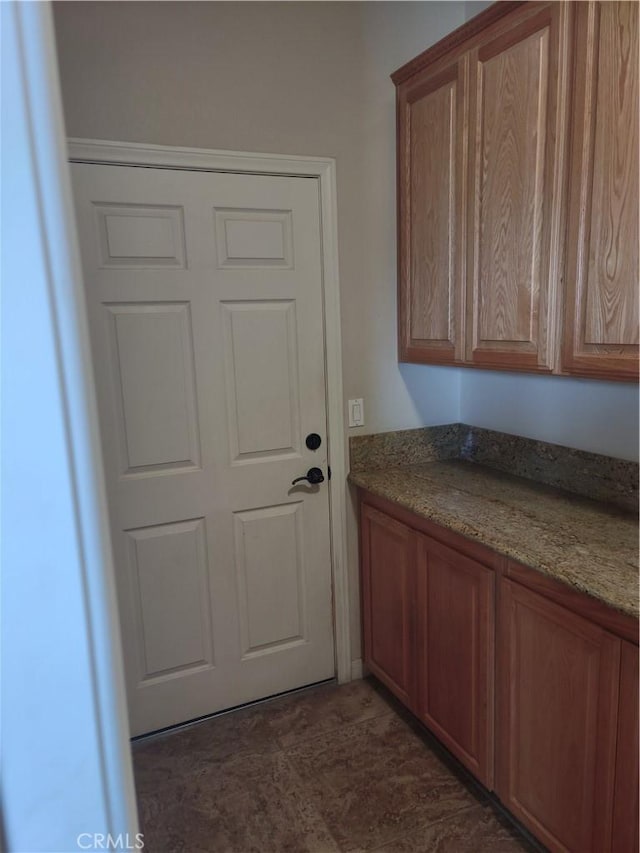 interior space featuring stone counters