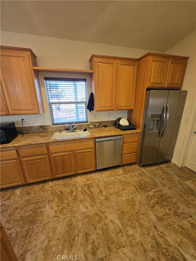 kitchen featuring stainless steel appliances and sink