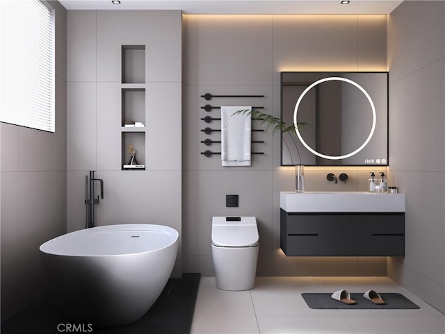 bathroom featuring vanity, toilet, and tile walls