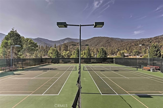 view of sport court with a mountain view and basketball court