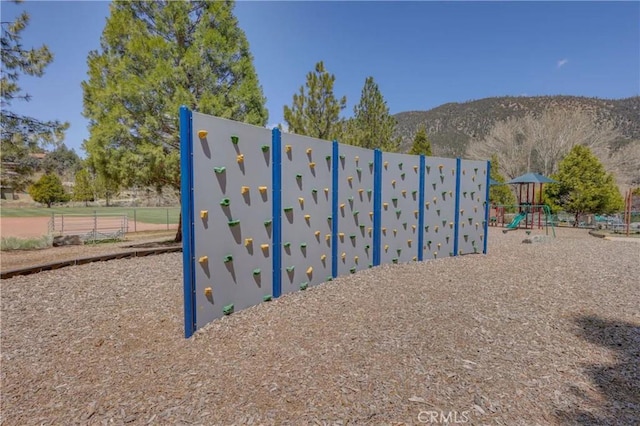 view of playground featuring a mountain view