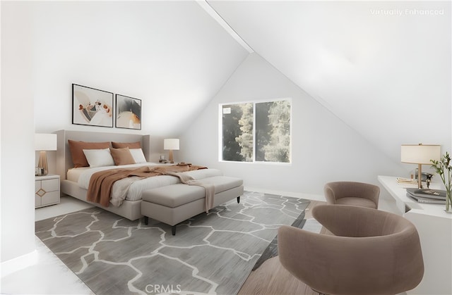 bedroom with lofted ceiling