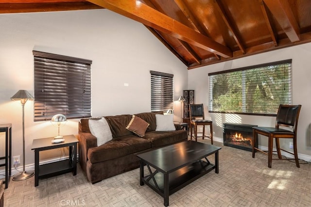 living room with high vaulted ceiling and beamed ceiling