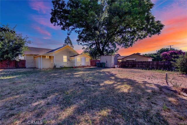 yard at dusk with a shed