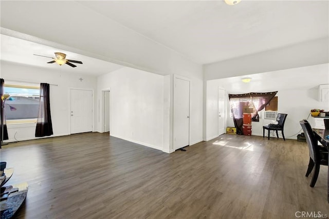 living room with dark wood-type flooring and ceiling fan