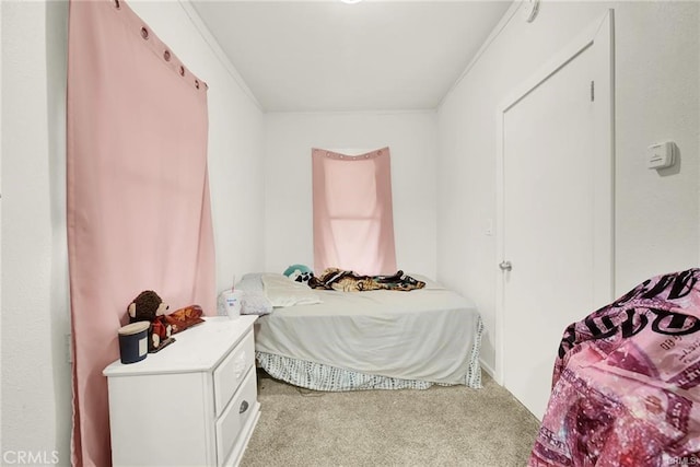 carpeted bedroom with crown molding