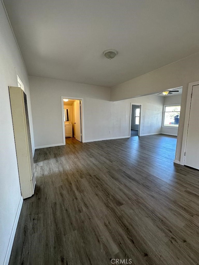 unfurnished living room featuring dark hardwood / wood-style floors