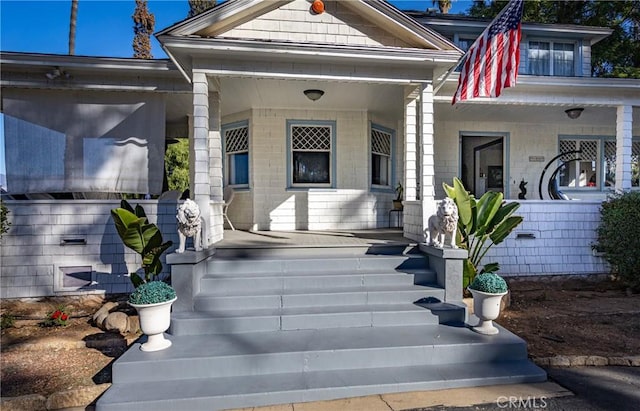 doorway to property with covered porch