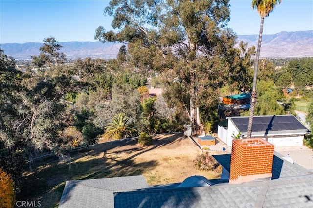 birds eye view of property featuring a mountain view