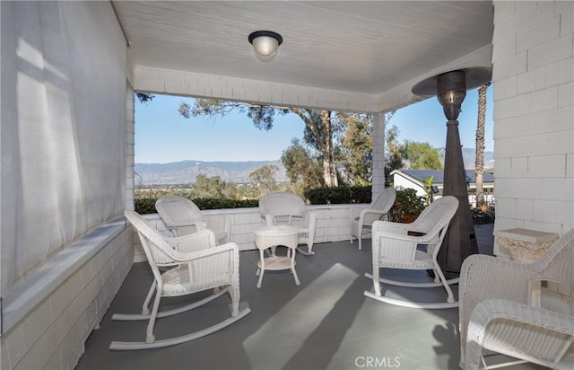 view of patio / terrace with a mountain view