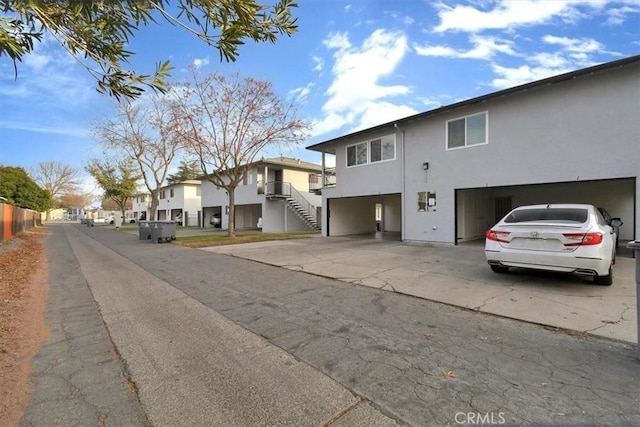 view of street featuring a residential view and stairs