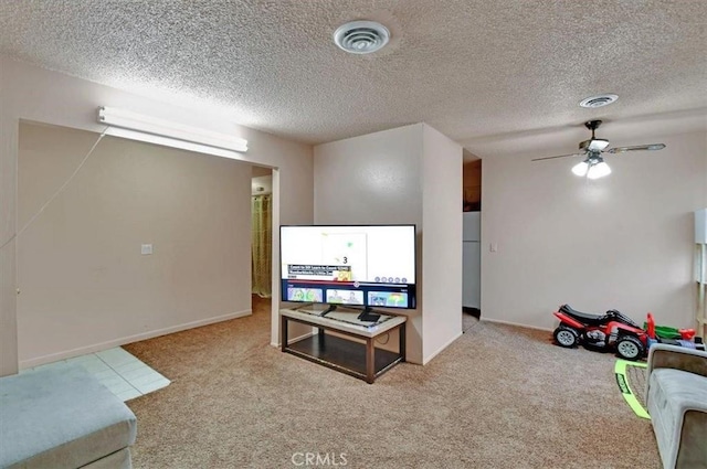 game room with a ceiling fan, light colored carpet, and visible vents