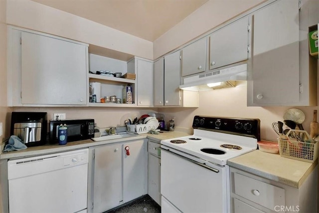 kitchen with under cabinet range hood, white appliances, a sink, light countertops, and open shelves