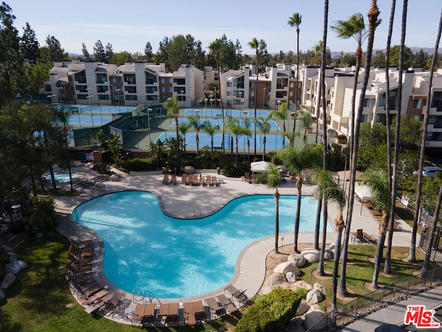 view of swimming pool featuring a patio area