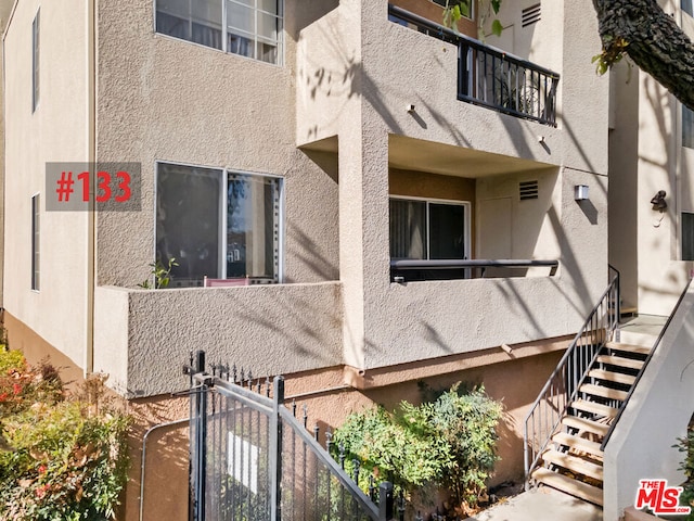 view of home's exterior featuring a balcony