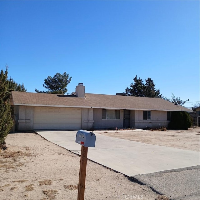 single story home featuring a garage