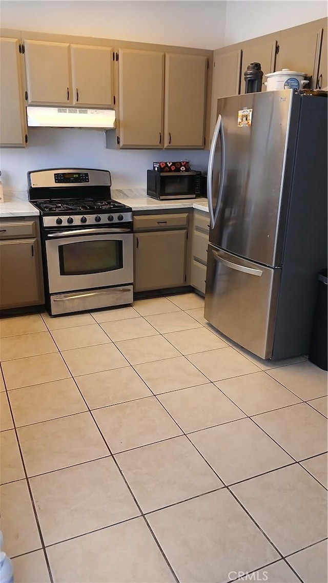 kitchen featuring light tile patterned floors and appliances with stainless steel finishes