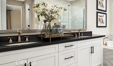 bathroom featuring vanity and a shower with door