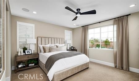 carpeted bedroom with ceiling fan