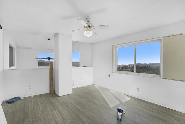 unfurnished room with ceiling fan and hardwood / wood-style floors