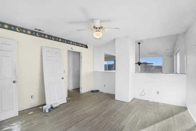 spare room with ceiling fan and hardwood / wood-style floors