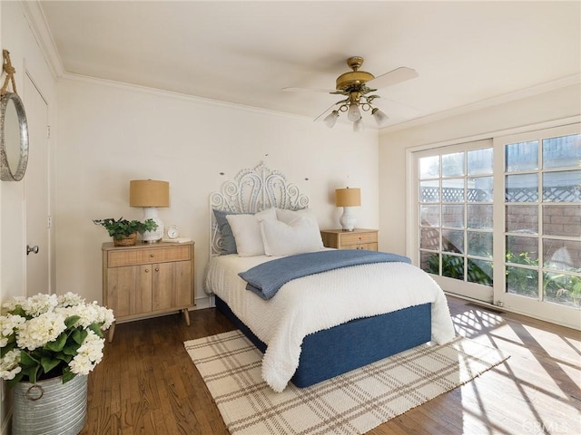 bedroom featuring ceiling fan, dark wood-type flooring, and ornamental molding