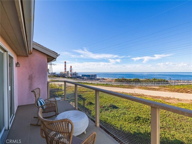 balcony featuring a water view