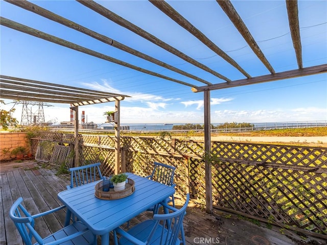 wooden terrace featuring a pergola and a water view