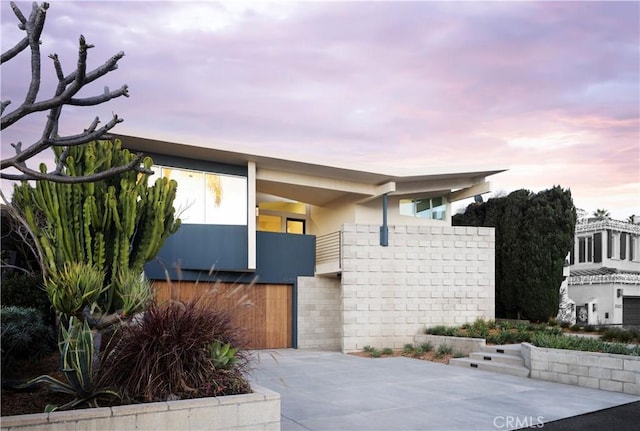 contemporary home with stucco siding