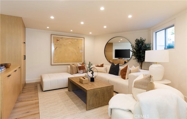 living room featuring baseboards, light wood finished floors, and recessed lighting