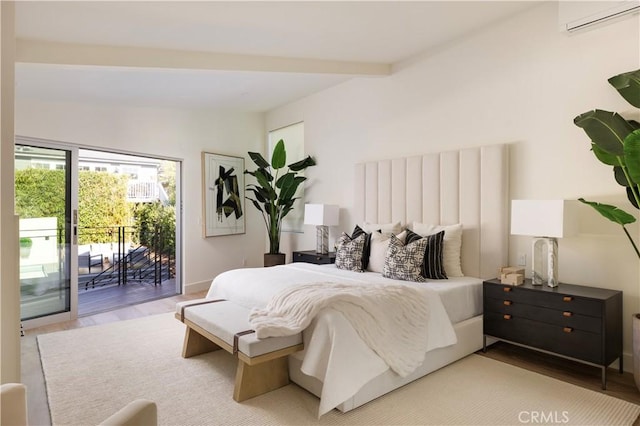 bedroom featuring lofted ceiling with beams, access to outside, and wood finished floors