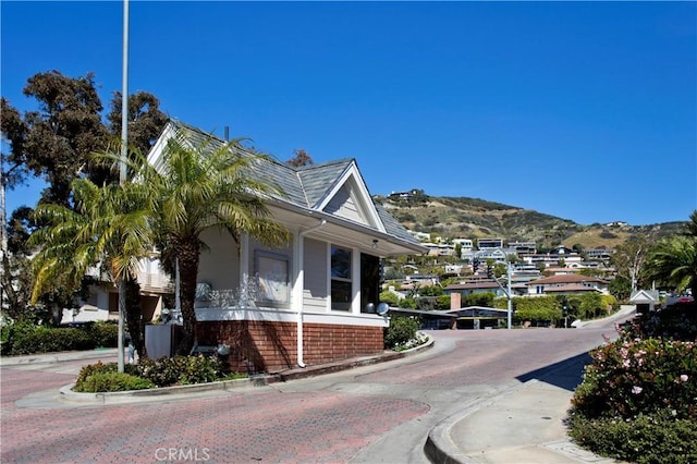 view of home's exterior with a mountain view