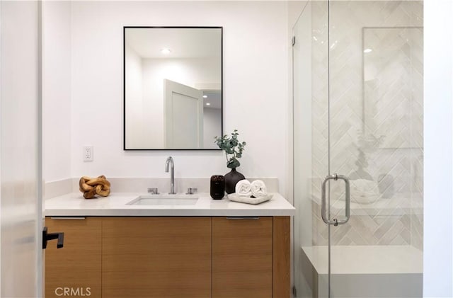 full bath featuring a stall shower and vanity