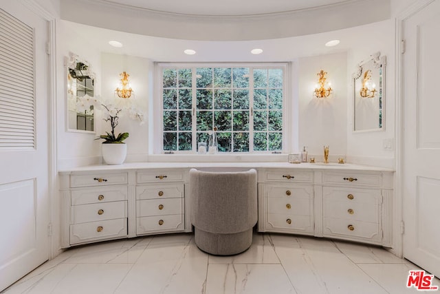 bathroom with vanity and ornamental molding