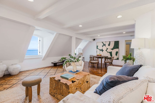 living room with beamed ceiling, a water view, and tile patterned floors