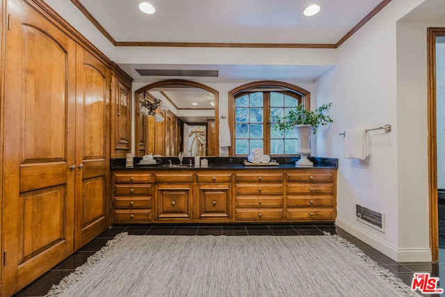 bathroom with tile patterned flooring, vanity, and ornamental molding