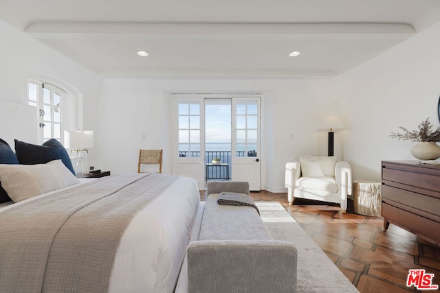 bedroom featuring beamed ceiling, access to exterior, parquet floors, and multiple windows