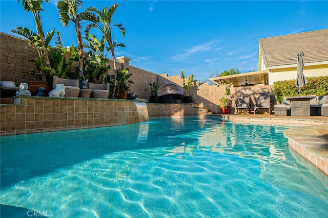 view of pool with pool water feature